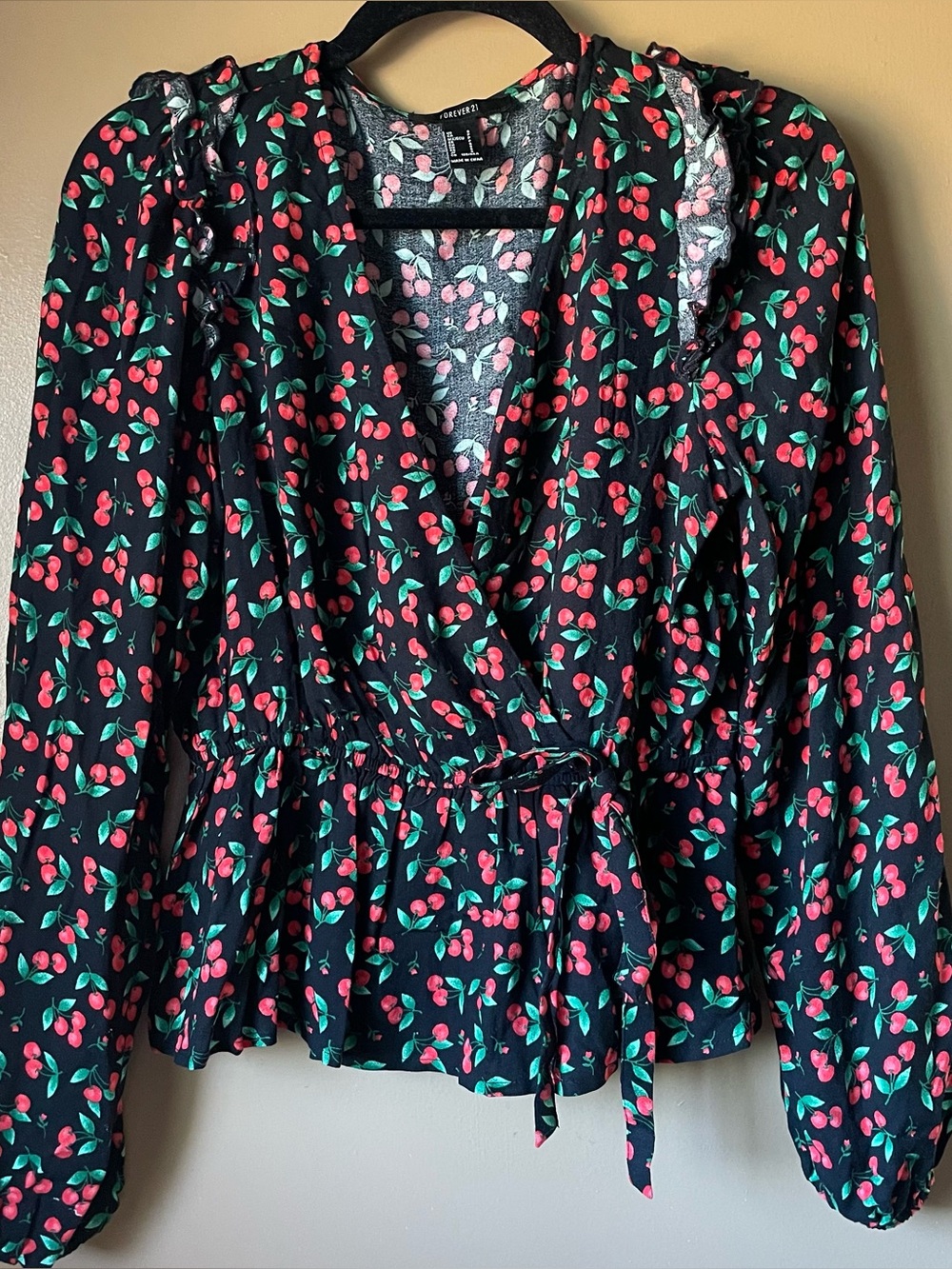 Black with cherry pattern long sleeved low cut blouse